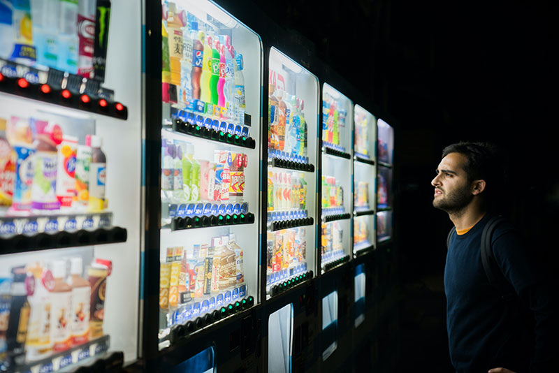 Man having trouble deciding what to purchase